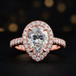 Front view of a pear cut halo lab-grown diamond engagement ring in 18kt rose gold.