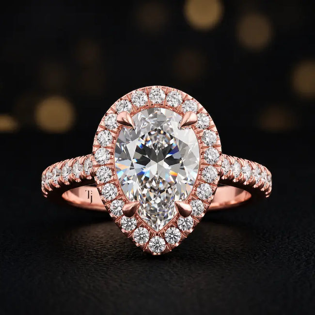 Front view of a pear cut halo lab-grown diamond engagement ring in 18kt rose gold.