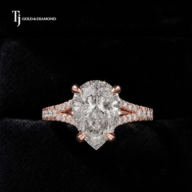 Front view of a pear cut split shank lab-grown diamond engagement ring in 18kt rose gold.