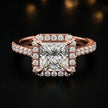 Front view of a princess cut halo lab-grown diamond engagement ring in 18kt rose gold.