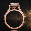 Side view of a princess cut halo lab-grown diamond engagement ring with diamond-set shoulders in 18kt rose gold.