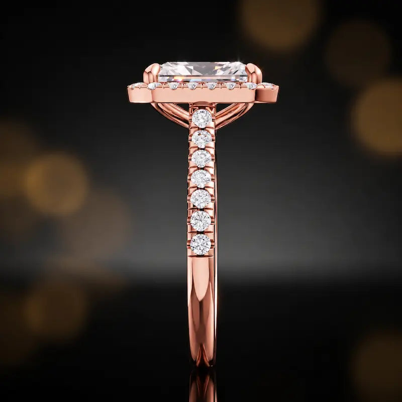 Side profile of a radiant cut halo lab-grown diamond engagement ring in 18kt rose gold.