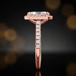 Side profile of a radiant cut halo lab-grown diamond engagement ring in 18kt rose gold.