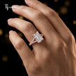 Radiant cut split shank lab-grown diamond engagement ring worn on hand in 18kt rose gold.