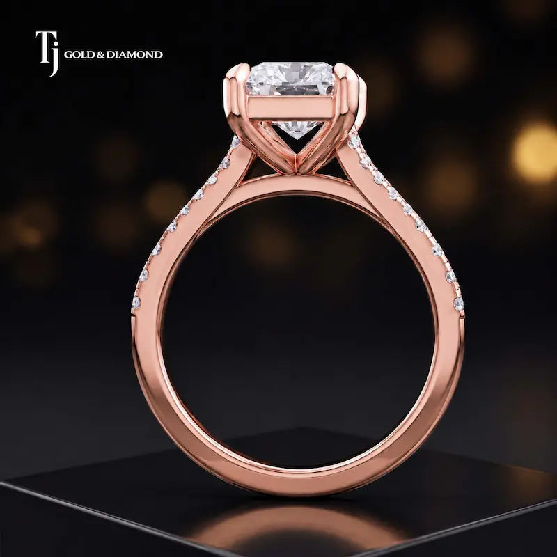 Side view of a radiant cut split shank lab-grown diamond engagement ring featuring a four-claw cathedral setting in 18kt rose gold.