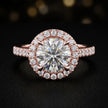 Front view of a round cut halo lab-grown diamond engagement ring in 18kt rose gold.