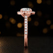 Side profile of a round cut halo lab-grown diamond engagement ring in 18kt rose gold.