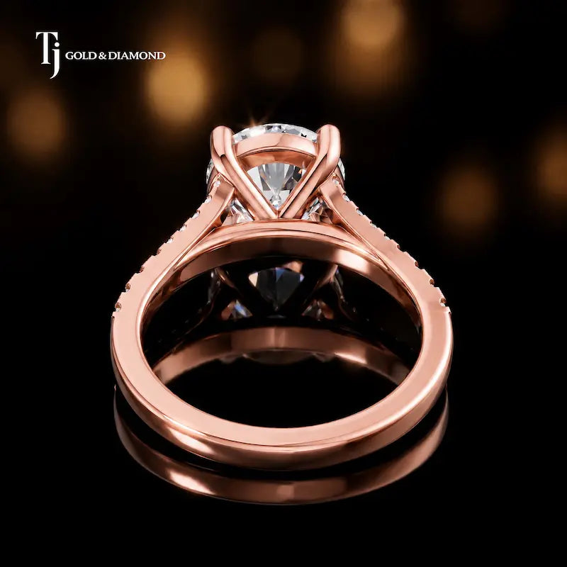 Back view of a round cut split shank lab-grown diamond engagement ring in 18kt rose gold.