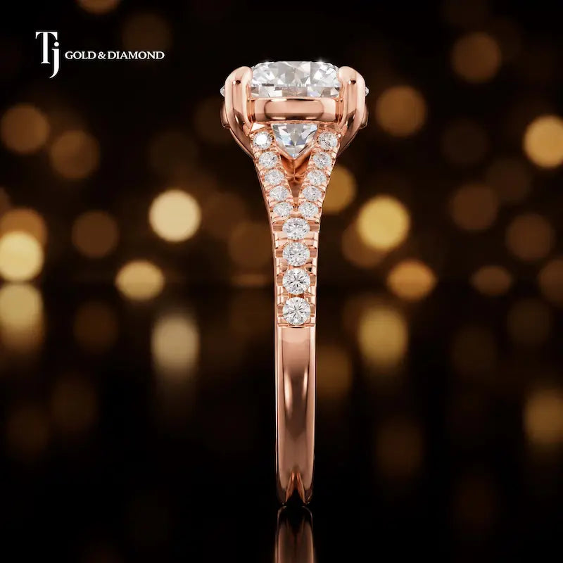Side profile of a round cut split shank lab-grown diamond engagement ring with diamond-set shoulders in 18kt rose gold.