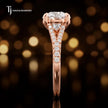 Side profile of a round cut split shank lab-grown diamond engagement ring with diamond-set shoulders in 18kt rose gold.