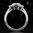 Front-on view of a radiant cut three-stone lab-grown diamond engagement ring in 18kt white gold showing the setting profile