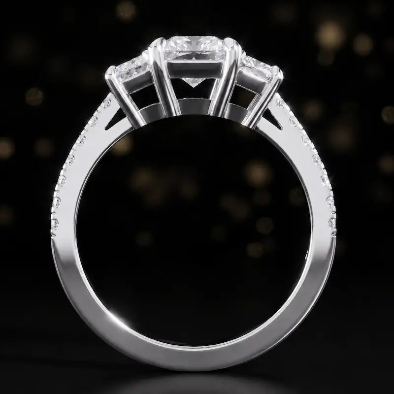 Front-on view of a radiant cut three-stone lab-grown diamond engagement ring in 18kt white gold showing the setting profile