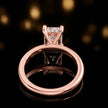 Back view of 4-claw radiant cut engagement ring with hidden halo in 18kt rose gold