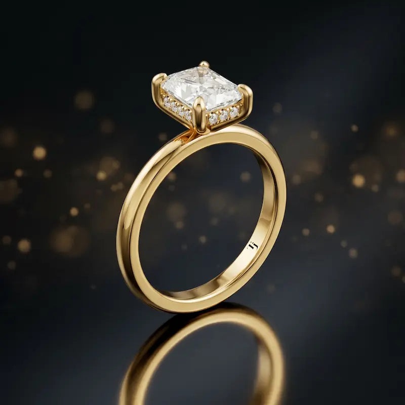 Side view of 4-claw radiant cut engagement ring with hidden halo in 18kt yellow gold