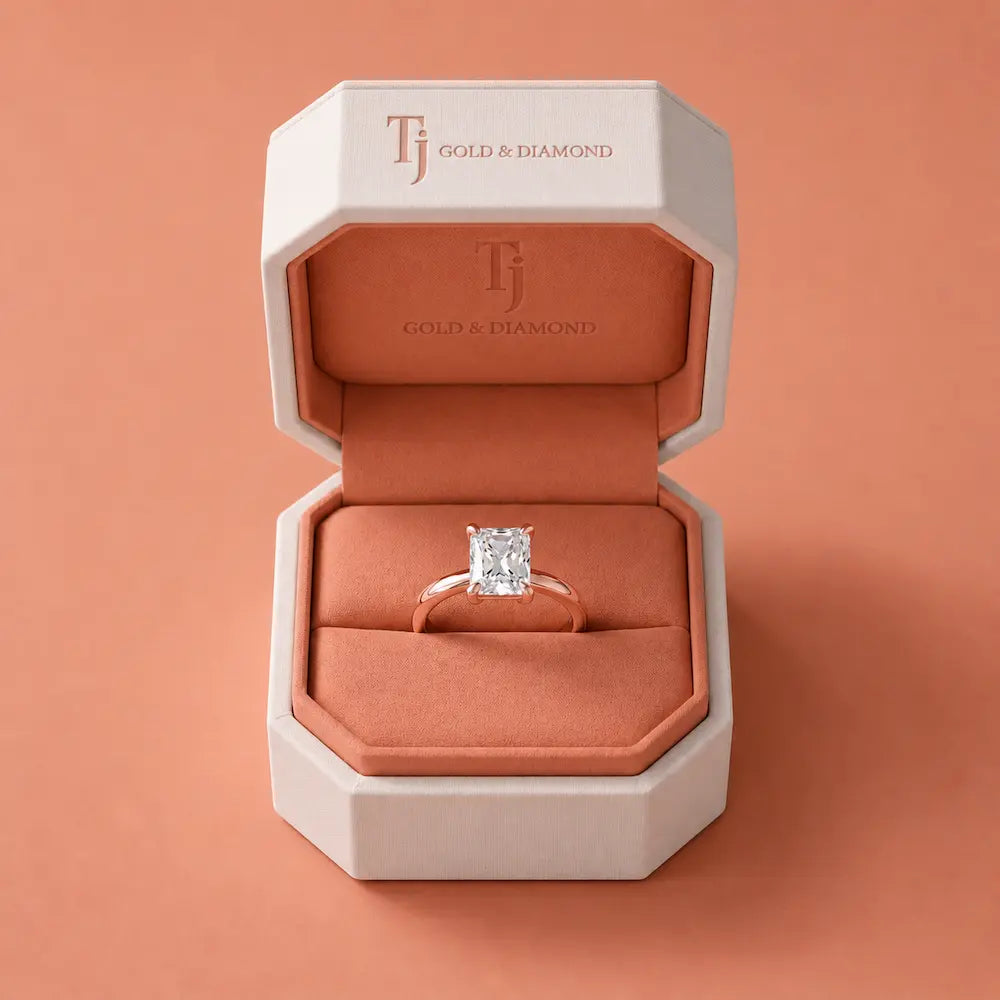 1.5 carat radiant cut diamond solitaire engagement ring in an 18kt rose gold 4 claw setting presented in a TJ Diamond signature ring box