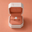 1.5 carat radiant cut diamond solitaire engagement ring in an 18kt rose gold 4 claw setting presented in a TJ Diamond signature ring box