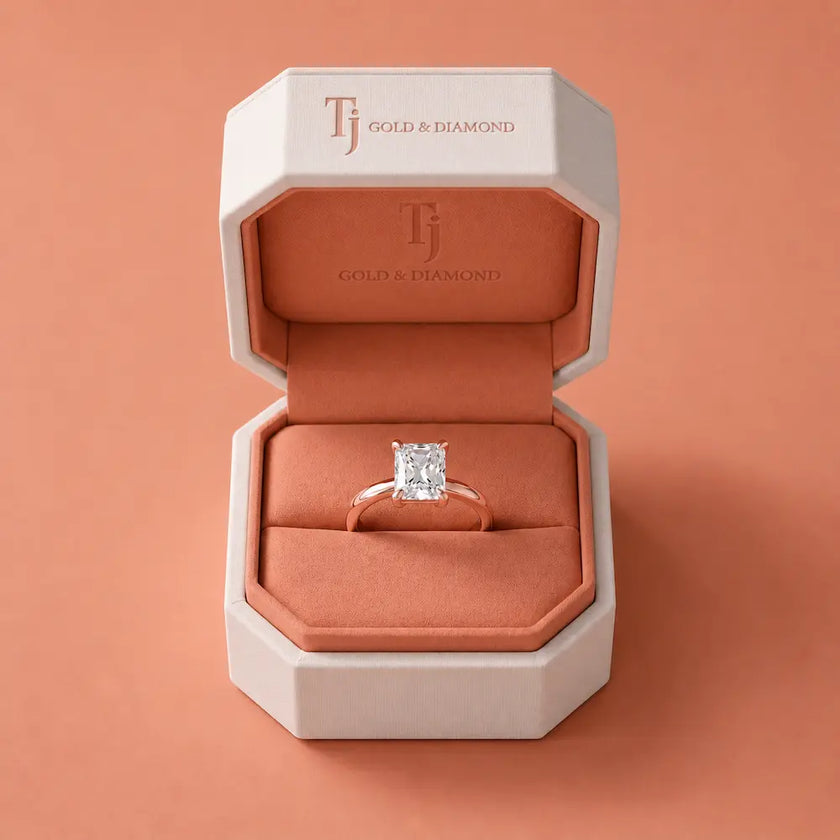 1.5 carat radiant cut diamond solitaire engagement ring in an 18kt rose gold 4 claw setting presented in a TJ Diamond signature ring box
