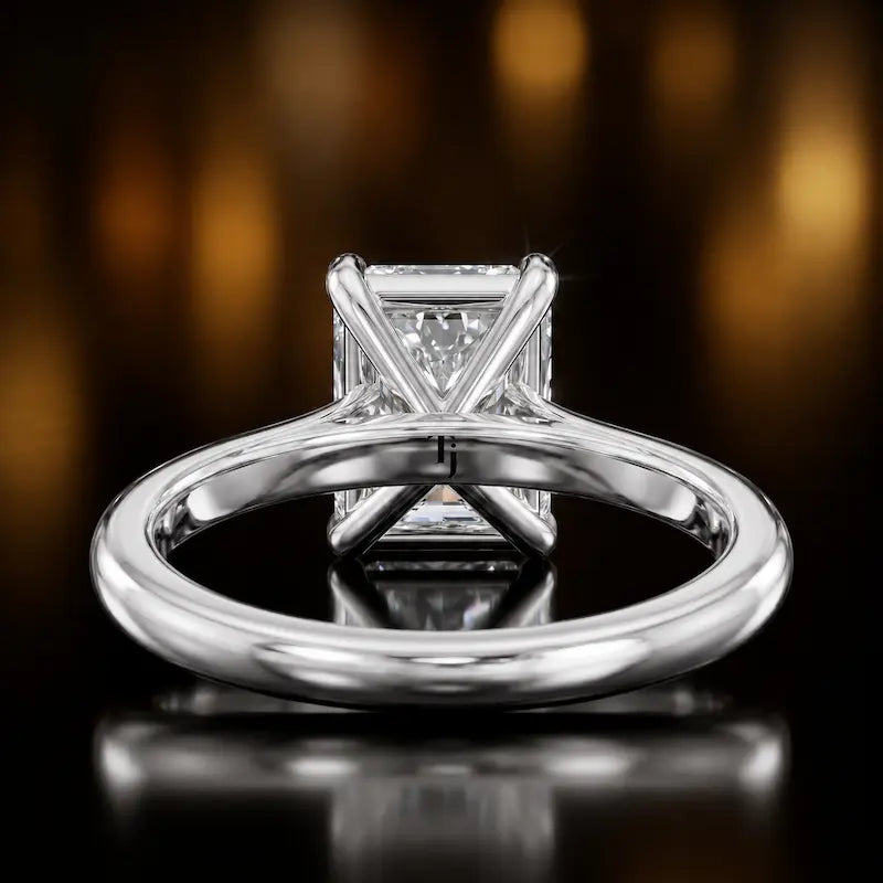 Back view of a 1.5 carat radiant cut diamond solitaire engagement ring showing the 4 claw setting and 18kt white gold band by TJ Diamond