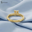 1.5 carat radiant cut lab-grown diamond solitaire engagement ring in 18kt yellow gold, back view on pink silk