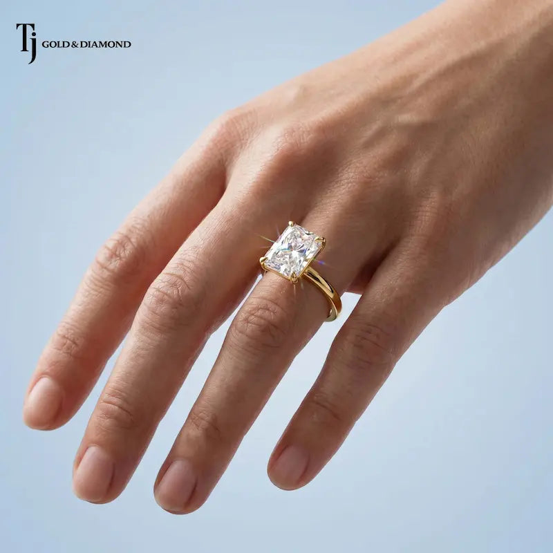 1.5 carat radiant cut lab-grown diamond solitaire engagement ring in 18kt yellow gold worn on the hand