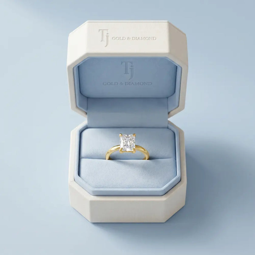1.5 carat radiant cut lab-grown diamond solitaire engagement ring in 18kt yellow gold presented in a TJ Diamond box
