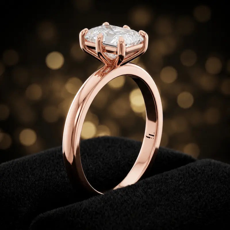 Front-on view of a 1.5 carat radiant cut diamond solitaire engagement ring showing the full 18kt rose gold band and 6 claw cathedral setting by TJ Diamond