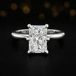 Front view of a 1.5 carat radiant cut diamond solitaire engagement ring in an 18kt white gold 6 claw setting by TJ Diamond