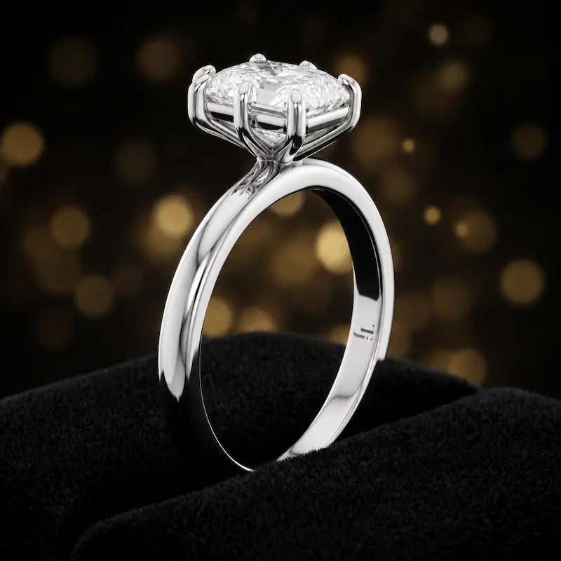 Front-on view of a 1.5 carat radiant cut diamond solitaire engagement ring showing the full 18kt white gold band and 6 claw cathedral setting by TJ Diamond