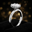Front-on view of a 1.5 carat radiant cut diamond solitaire engagement ring showing the full 18kt white gold band and 6 claw cathedral setting by TJ Diamond