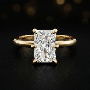 Front view of a 1.5 carat radiant cut diamond solitaire engagement ring in an 18kt yellow gold 6 claw setting by TJ Diamond