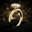 Front-on view of a 1.5 carat radiant cut diamond solitaire engagement ring showing the full 18kt yellow gold band and 6 claw cathedral setting by TJ Diamond