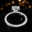 Back view of 4-claw round cut engagement ring with hidden halo in 18kt white gold