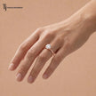 1.5 carat round cut lab-grown diamond solitaire engagement ring in 18kt rose gold worn on hand