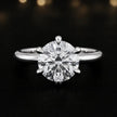 Front view of a 1.5 carat round brilliant cut diamond solitaire engagement ring in an 18kt white gold 6 claw setting by TJ Diamond