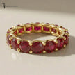 Created ruby full eternity ring in 18kt yellow gold featuring round brilliant lab-created rubies in a shared prong setting.