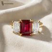 Front View of an Emerald cut lab-created ruby trilogy engagement ring in 18kt yellow gold with emerald cut lab-grown diamond side stones.