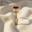 Side Profile of an Emerald cut lab-created ruby trilogy engagement ring in 18kt yellow gold with emerald cut lab-grown diamond side stones.