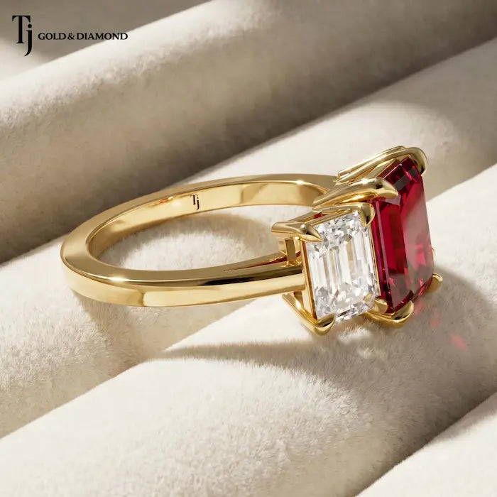 Side View of Emerald cut lab-created ruby trilogy engagement ring in 18kt yellow gold with emerald cut lab-grown diamond side stones.