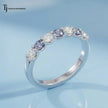 Angled view of an Alternating Lab-Created Sapphire & Lab-Grown Diamond Half Eternity Ring in 18kt white gold.