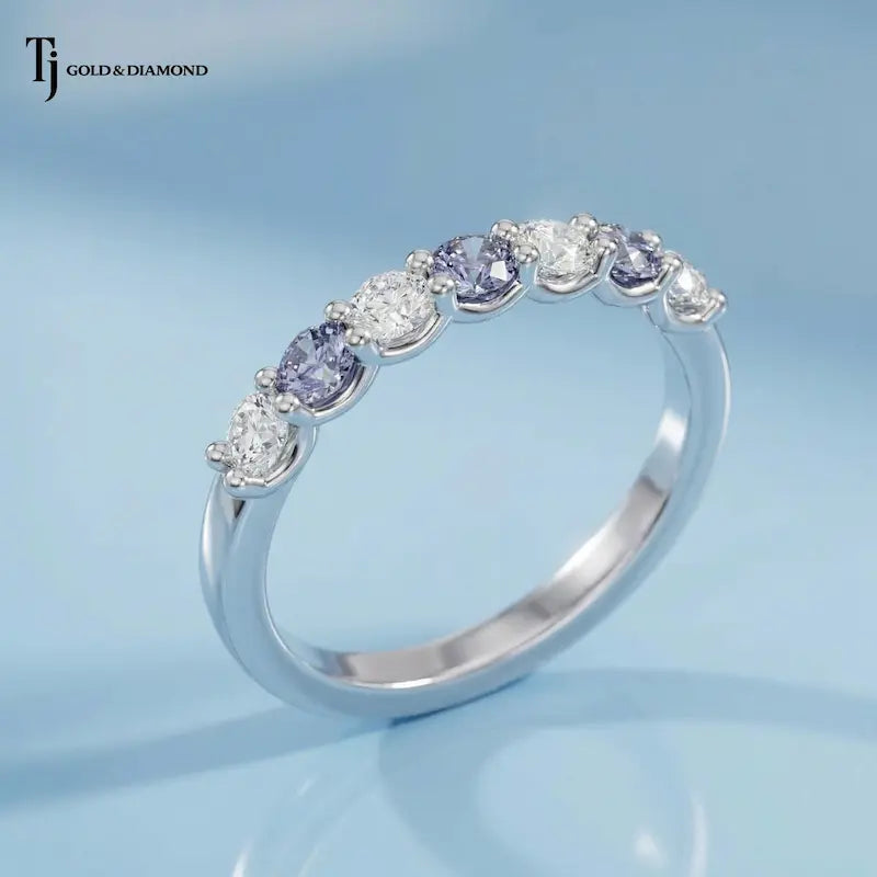 Angled view of an Alternating Lab-Created Sapphire & Lab-Grown Diamond Half Eternity Ring in 18kt white gold.