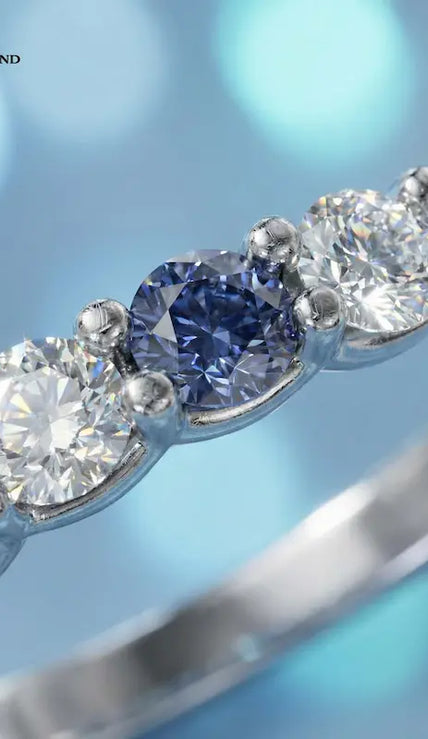 Close up of Alternating Lab-Created Sapphire & Lab-Grown Diamond Half Eternity Ring in 18kt white gold.