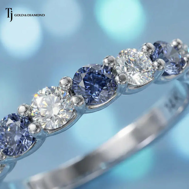 Close up of Alternating Lab-Created Sapphire & Lab-Grown Diamond Half Eternity Ring in 18kt white gold.