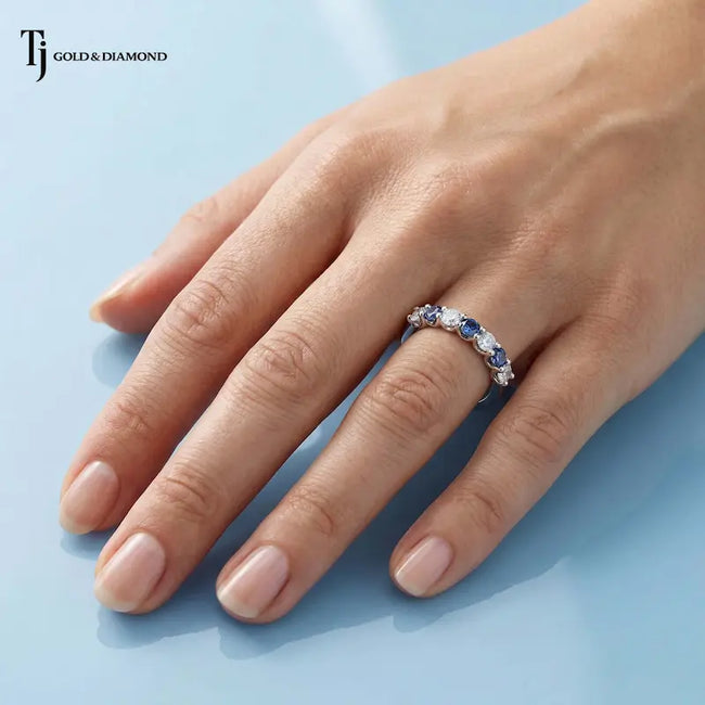Alternating Lab-Created Sapphire & Lab-Grown Diamond Half Eternity Ring worn on the hand in 18kt white gold.