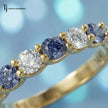 Close-up of an Alternating Created Sapphire & Lab-Grown Diamond Half Eternity Ring in 18kt Yellow Gold featuring round blue sapphires and brilliant diamonds.