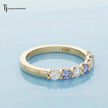 Side profile of an Alternating Sapphire & Lab-Grown Diamond Half Eternity Ring in 18kt Yellow Gold with shared prong setting.