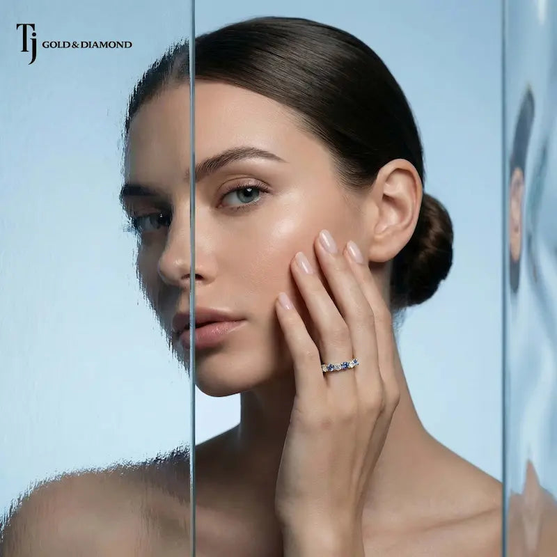 Model wearing an Alternating Sapphire & Lab-Grown Diamond Half Eternity Ring in 18kt Yellow Gold handcrafted in New Zealand.