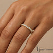 Scallop setting full eternity diamond wedding band in 18kt yellow gold worn on hand with round brilliant lab-grown diamonds.