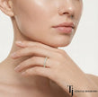 Model wearing a scallop setting full eternity diamond wedding band in 18kt yellow gold with round brilliant lab-grown diamonds.