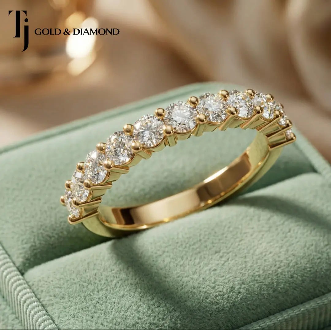 Top view of Shared Prong Half Eternity diamond wedding band in 18kt yellow gold, round brilliant diamonds set prong to prong