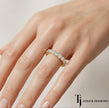 Shared Prong Half Eternity diamond wedding band worn on hand, 18kt yellow gold with round brilliant lab-grown diamonds